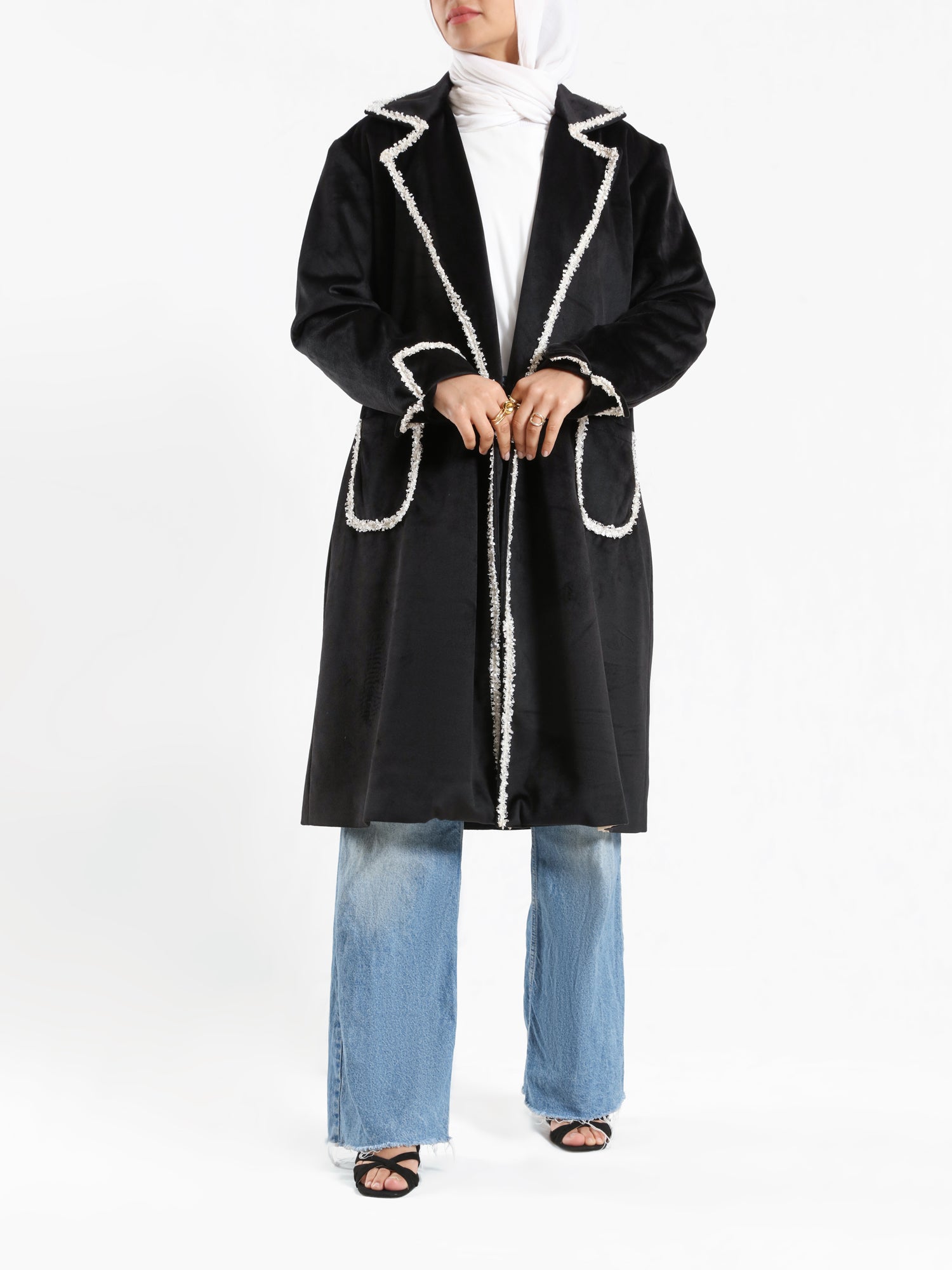 Elegant Suede Coat in black wool with engraved stitching, a long modest winter coat blending warmth, sophistication, and timeless style