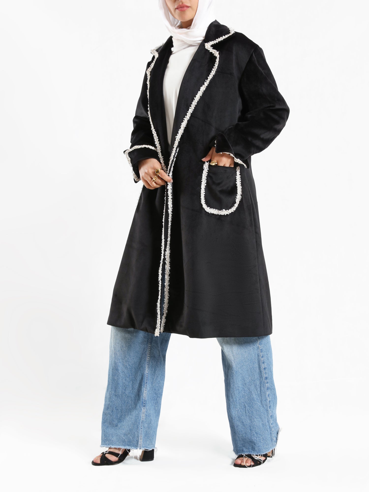 Elegant Suede Coat in black wool with engraved stitching, a long modest winter coat blending warmth, sophistication, and timeless style