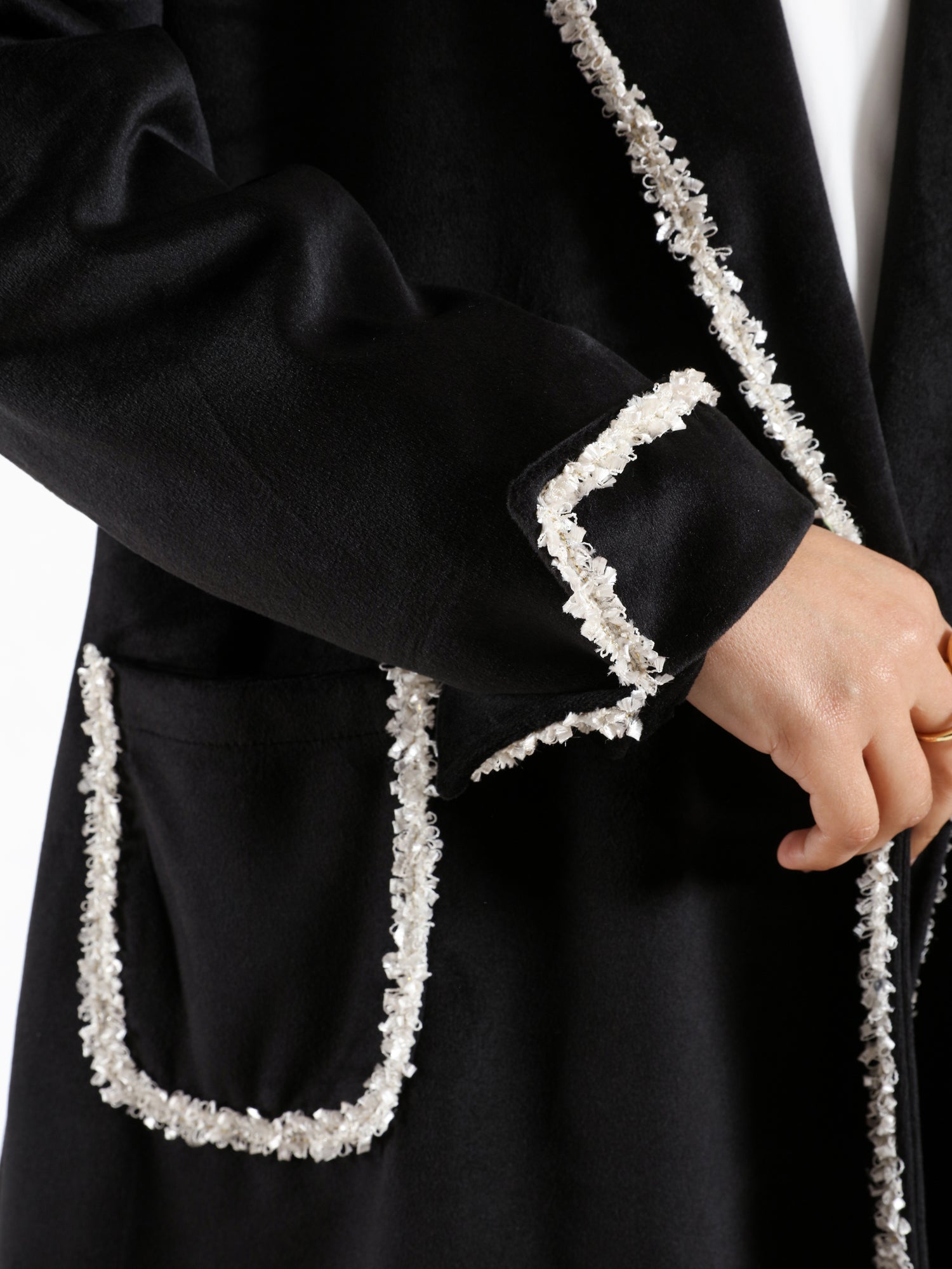 Elegant Suede Coat in black wool with engraved stitching, a long modest winter coat blending warmth, sophistication, and timeless style