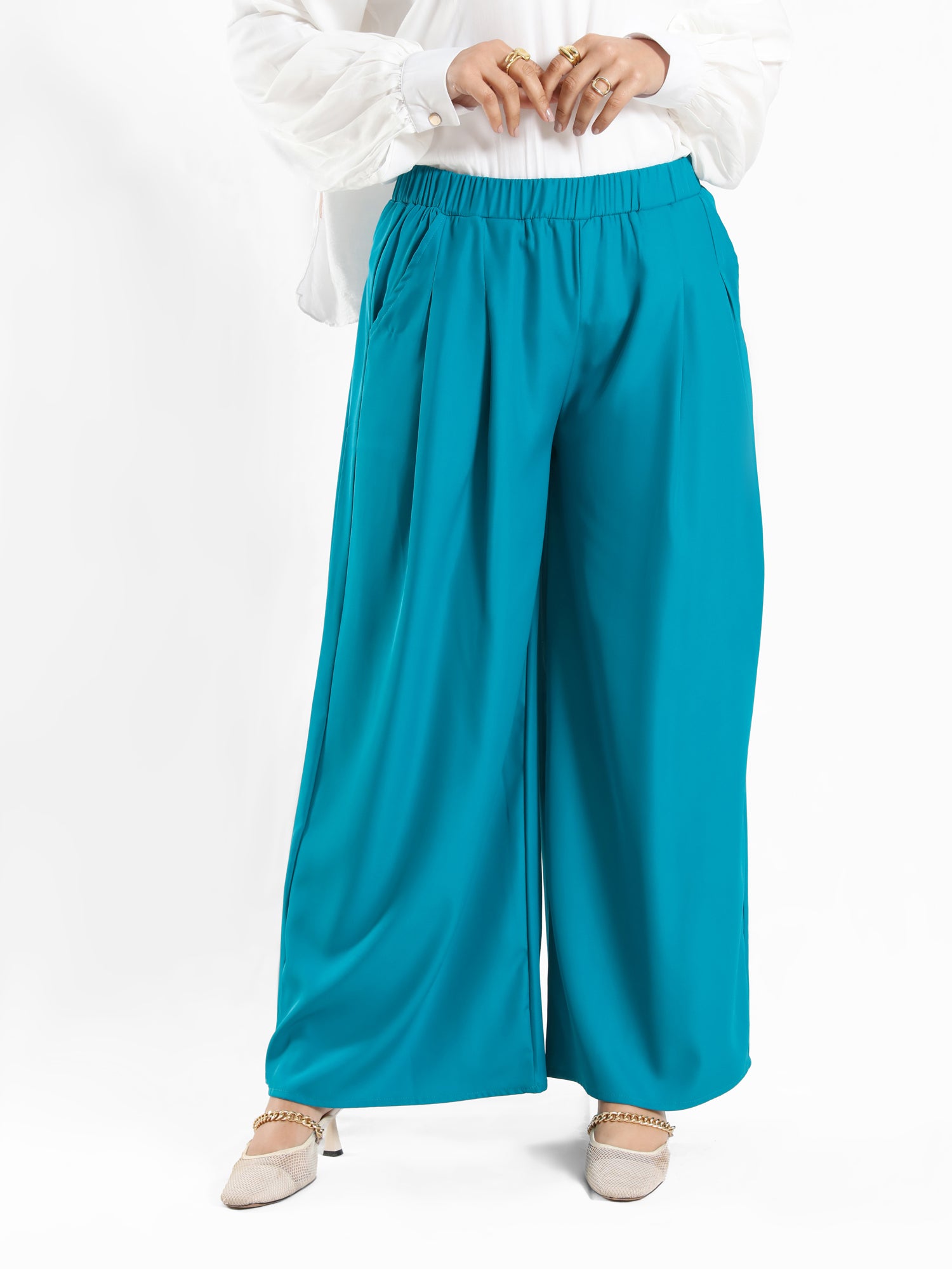 Floret Twirl Pants in wide-leg fit, available in turquoise, black, and beige—lightweight and modest for summer styling