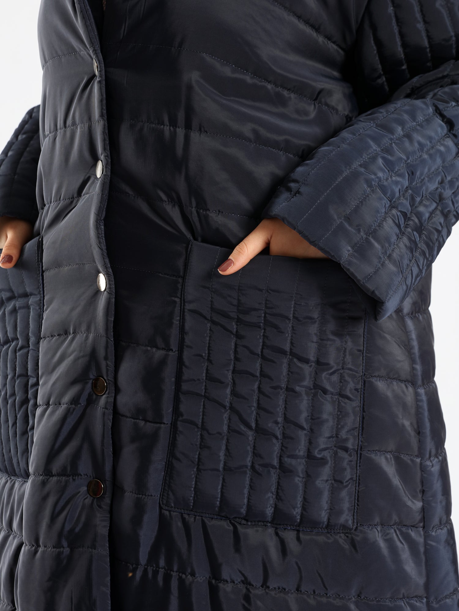Long waterproof puffer coat with quilted texture and full coverage, ideal for modest winter wear in navy, beige, or grey
