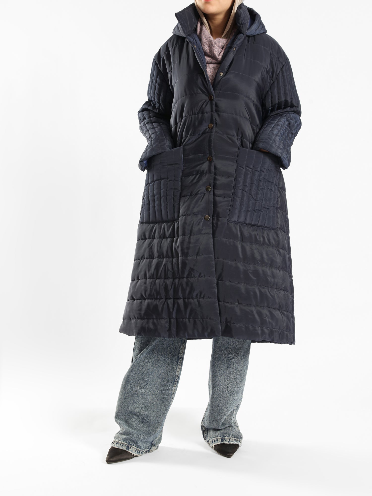 Long waterproof puffer coat with quilted texture and full coverage, ideal for modest winter wear in navy, beige, or grey