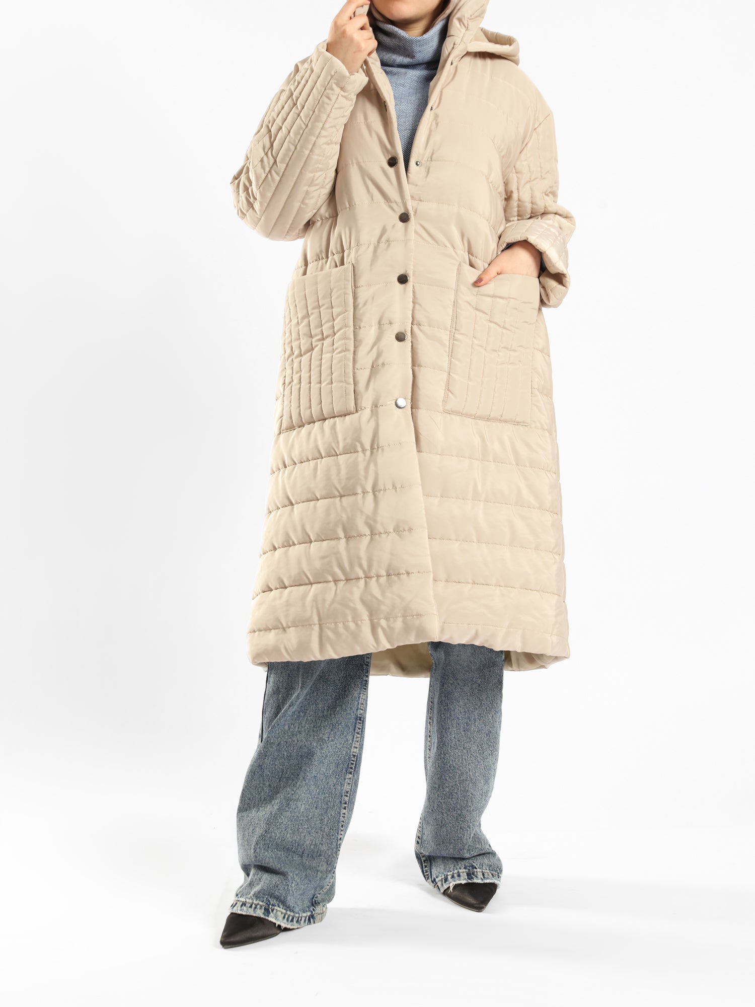 Long waterproof puffer coat with quilted texture and full coverage, ideal for modest winter wear in navy, beige, or grey