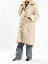 Long waterproof puffer coat with quilted texture and full coverage, ideal for modest winter wear in navy, beige, or grey