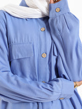 Petal Pocket Blouse in linen blend with front pockets, a relaxed-fit modest top in baby blue, mauve, or white for summer wear